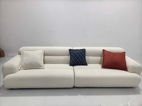 Low-Profile Floor-Standing Cream Boucl&eacute; Three-Seat Upholstered Sofa