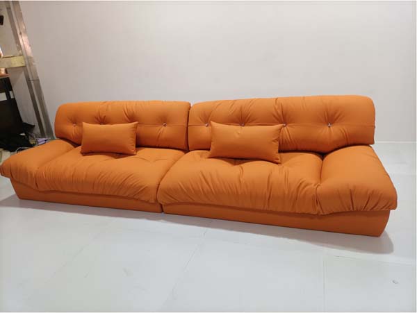Armless Low-Profile Four-Seater Tufted Orange Fabric Sofa