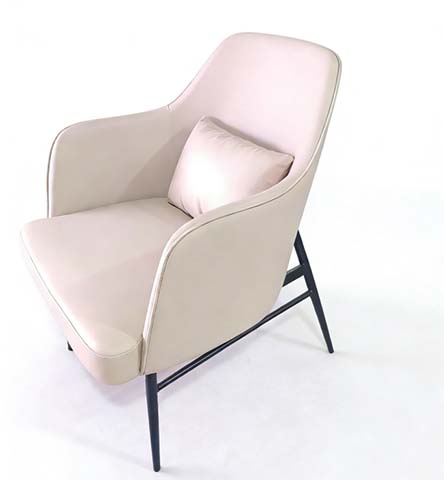 Blush Pink Enveloping Upholstered Lounge Armchair with Black Metal Cross-Braced Legs and Matching Throw Pillow