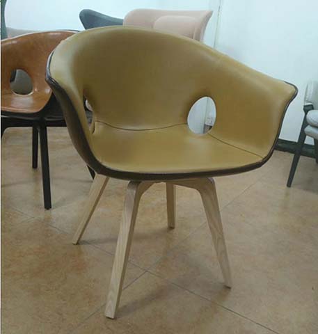 Mustard Upholstered Dining Armchair with Circular Back Cutout and Splayed Bentwood Legs