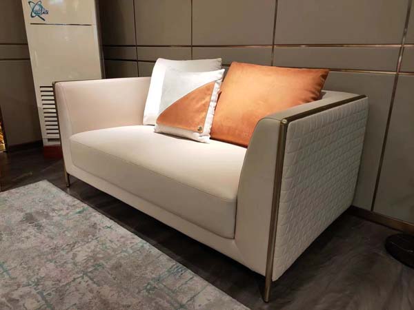 Light Beige Quilted Arm Two-Seat Loveseat with Bronze Metal Trim