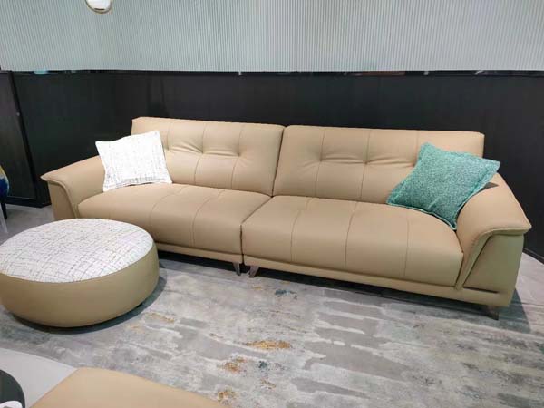 Beige Grid-Stitched Curved-Arm Three-Seater Upholstered Sofa with Matching Round Ottoman