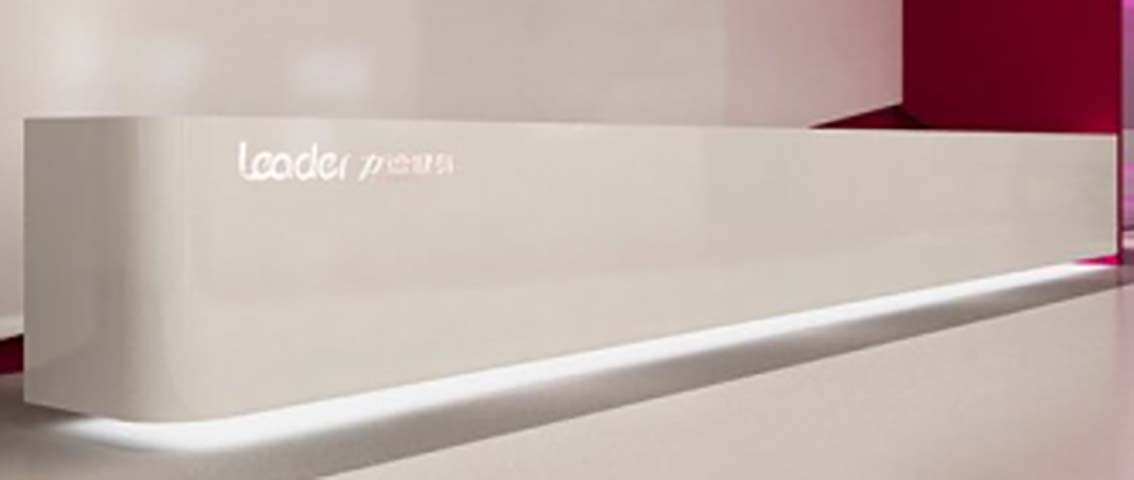 Monolithic Matte Off-White Curved Reception Desk with Illuminated Plinth