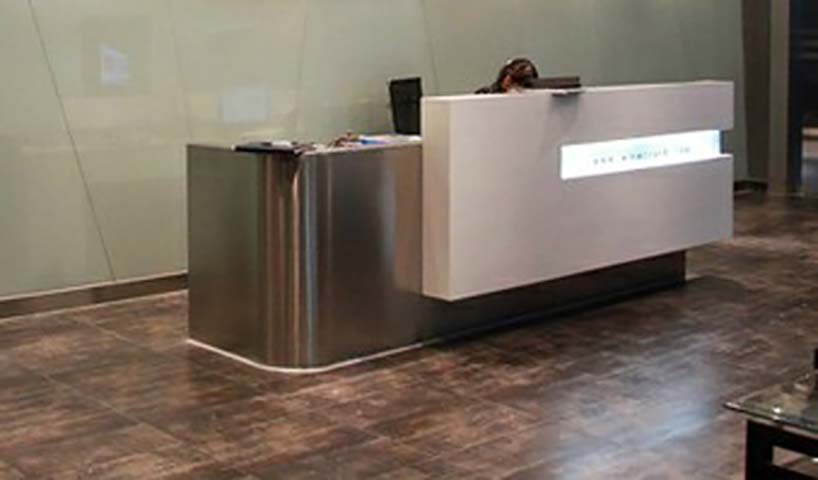L-Shaped Curved Brushed Stainless Steel Reception Desk with Illuminated Sign Panel