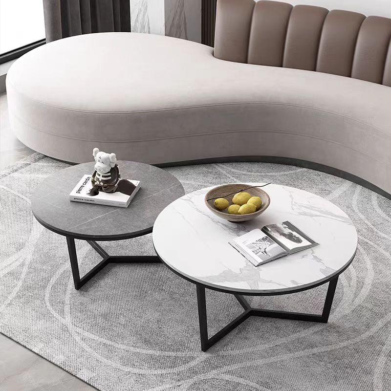 2-Piece Round Nesting Coffee Table Set with Two-Tone Stone-Effect Tops and Black Metal Cross Base