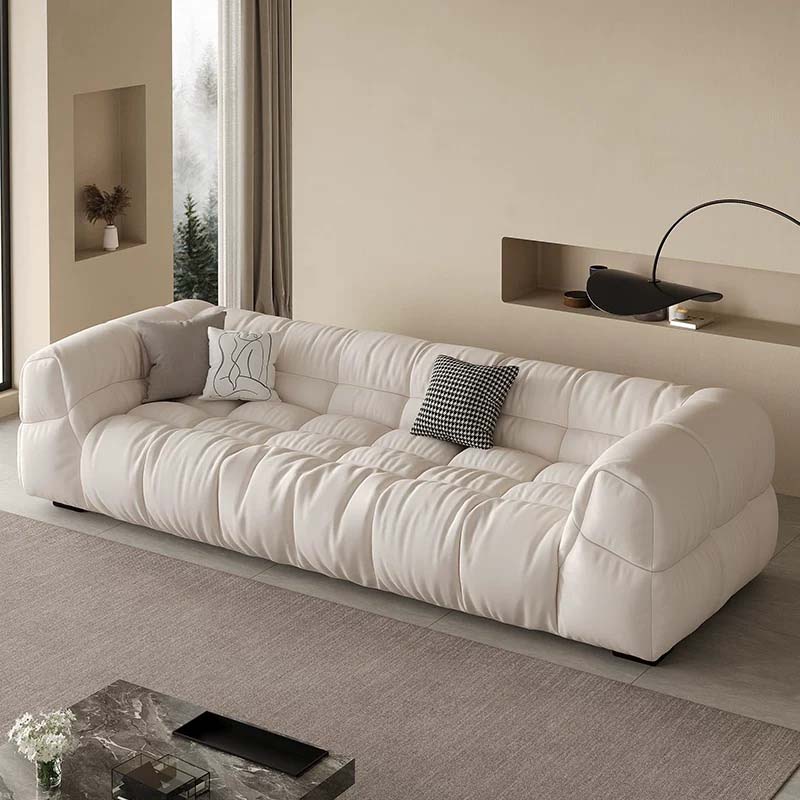Cream Quilted Three-Seater Upholstered Sofa