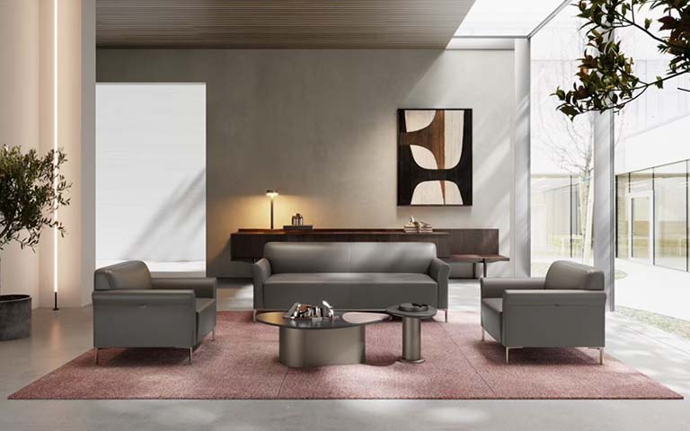 Gray Upholstered Three-Seat Sofa with Two Matching Armchairs and Round Metal Coffee Tables